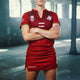 Women's red polo jersey with V-neck, geometric print, and short sleeves