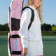 Pastel pink large hockey stick bag with black straps and front pocket