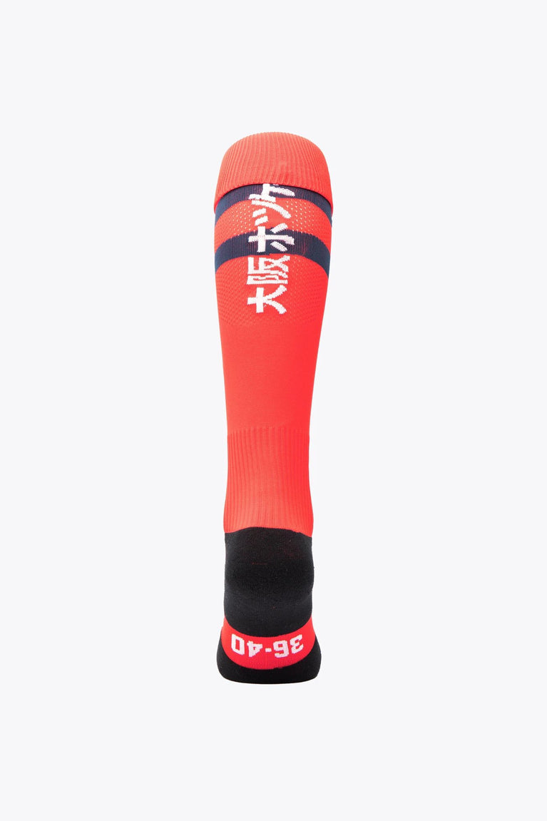 KHC Brugge Field Hockey Socks in red and navy with Osaka logo in green. Back view