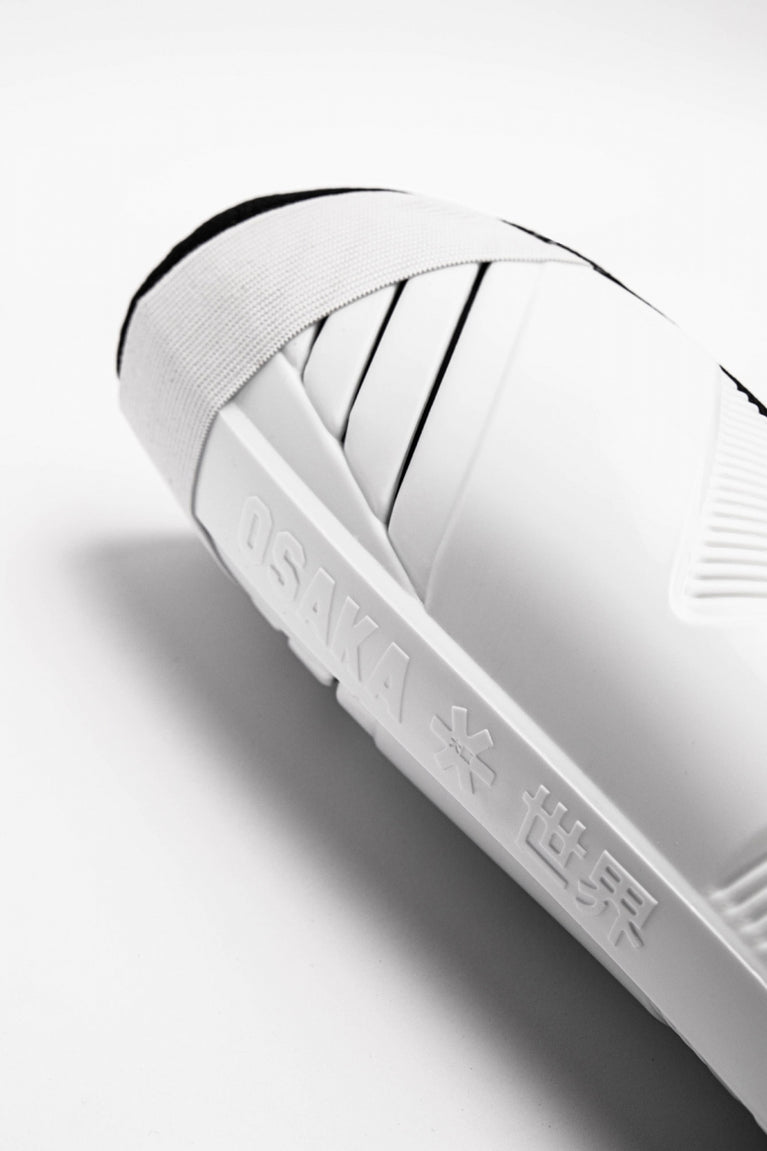 Osaka Shinguard white and black with logo. Close view