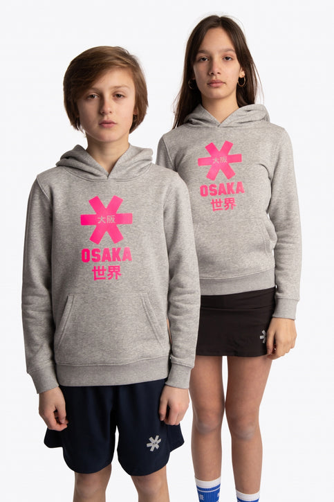 Boy and girl wearing the Osaka kids hoodie in grey with pink star logo. Front view