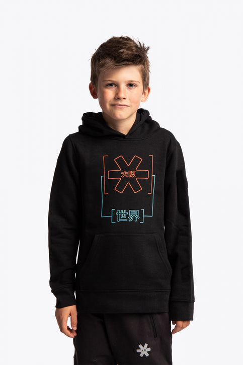 Girl wearing the Osaka kids trace hoodie in black with logo in orange and blue. Front and back view