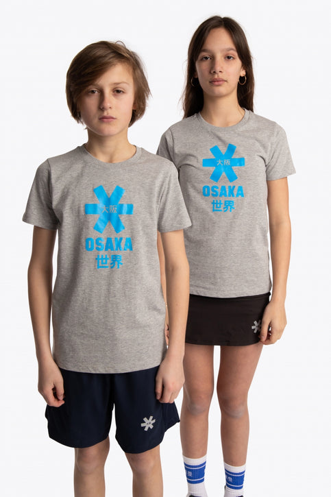 Boy and girl wearing the Osaka kids tee short sleeve grey with logo in blue. Front view