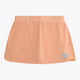 Osaka women ball skort in peach with logo in grey. Front flatlay view
