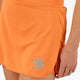 Woman wearing the Osaka women ball skort in orange with logo in white. Detail logo view
