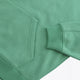 Osaka women half zip sweater green. Front detail flatlay sleeve view