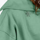 Woman wearing the Osaka women half zip sweater green. Back detail neck view