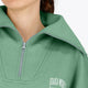 Woman wearing the Osaka women half zip sweater green. Front detail neck view
