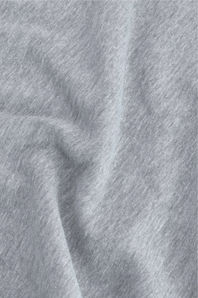 Osaka women half zip sweater in heather grey with white logo. Detail fabric view