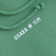 Osaka women hoodie in green with white logo. Detail front logo view