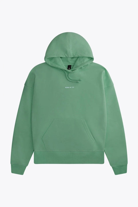Osaka Women Hoodie | Green Osaka women hoodie in green with white logo. Front flatlay view