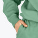 Osaka women hoodie in green with white logo. Detail sleeve view