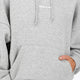 Woman wearing the Osaka women hoodie in heather grey with white logo. Front view