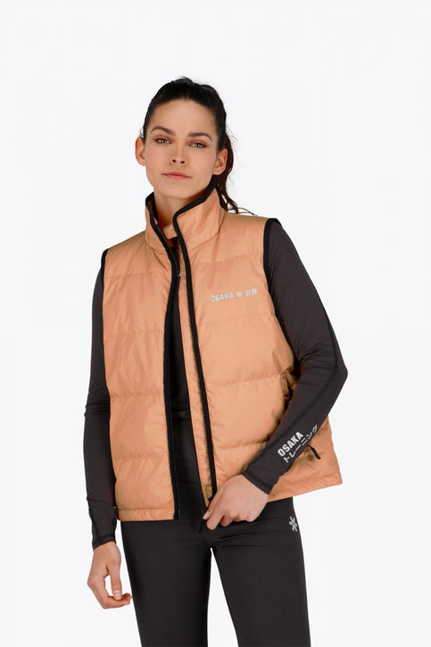 Osaka women padded gilet in peach with grey logo. Front flatlay view