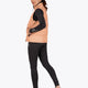 Woman wearing the Osaka women padded gilet in peach with grey logo. Back view