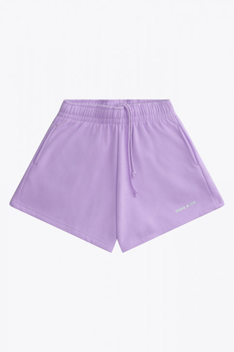 Osaka women shorts in light purple with logo in white. Front flatlay view