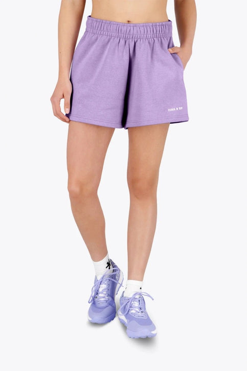 Osaka Women Shorts | Light Purple Osaka women shorts in light purple with logo in white. Front flatlay view