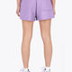 Woman wearing the Osaka women shorts in light purple with logo in white. Back view
