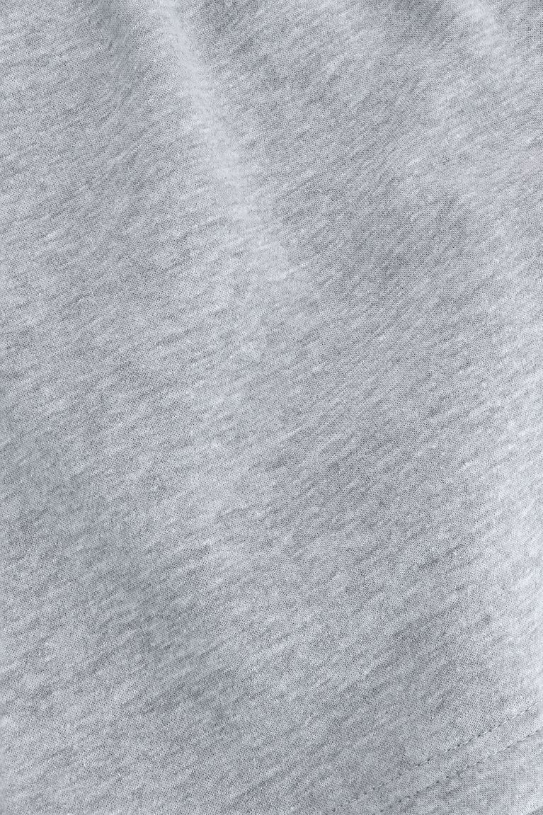 Osaka women shorts in heather grey with logo in white. Detail fabric view