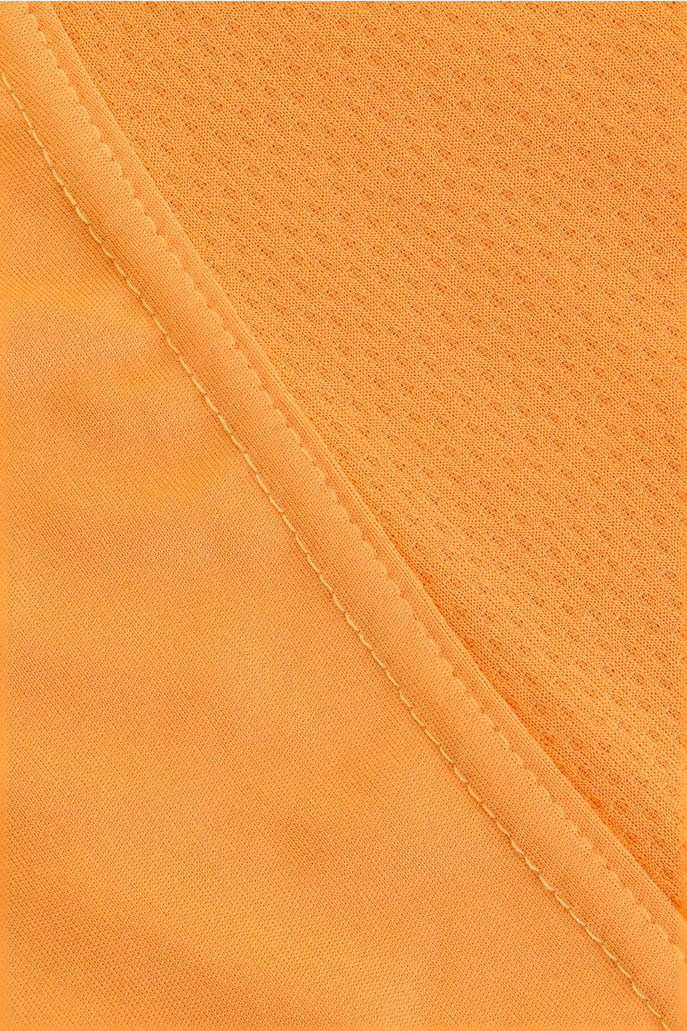 Osaka women singlet in orange with logo in grey. Detail fabric view
