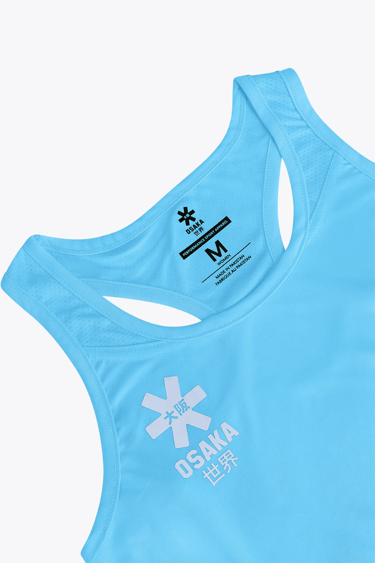 Osaka women singlet in light blue with logo in grey. Front flatlay detail view