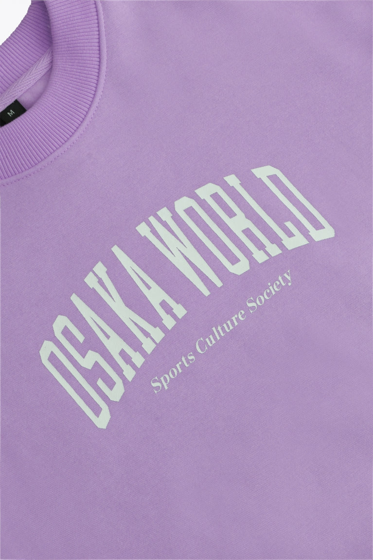 Osaka women sweater in light purple with logo in white. Front flatlay detail logo view