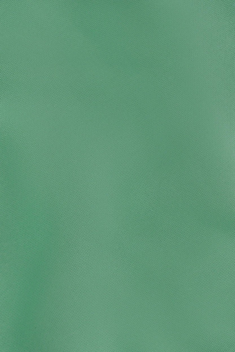 Osaka women sweater in green with logo in white. Detail fabric view