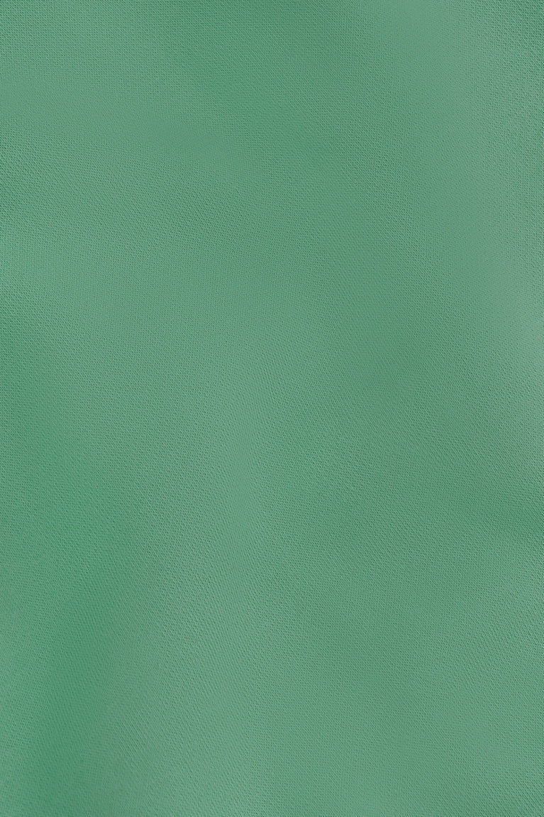 Osaka women sweater in green with logo in white. Detail fabric view