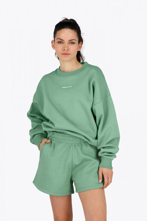 Osaka Women Sweater | Green Osaka women sweater in green with logo in white. Front flatlay view