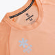 Osaka women tee short sleeve in peach with logo in grey. Front flatlay detail view