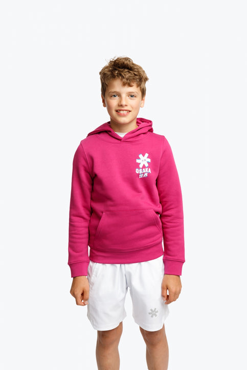 Boy and girl wearing the Osaka kids hoodie in pink and off-set star logo in white and blue. Front view