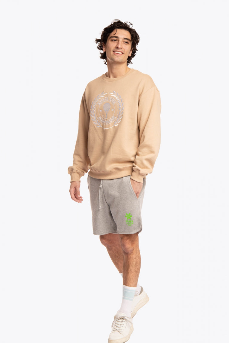 Man wearing the Osaka x Buenas Open sweater in stone. Front view