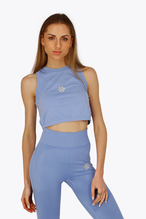 Osaka Women Tech Tank | Manor Blue Osaka women tech tank top in manor blue with logo in grey. Front flatlay view