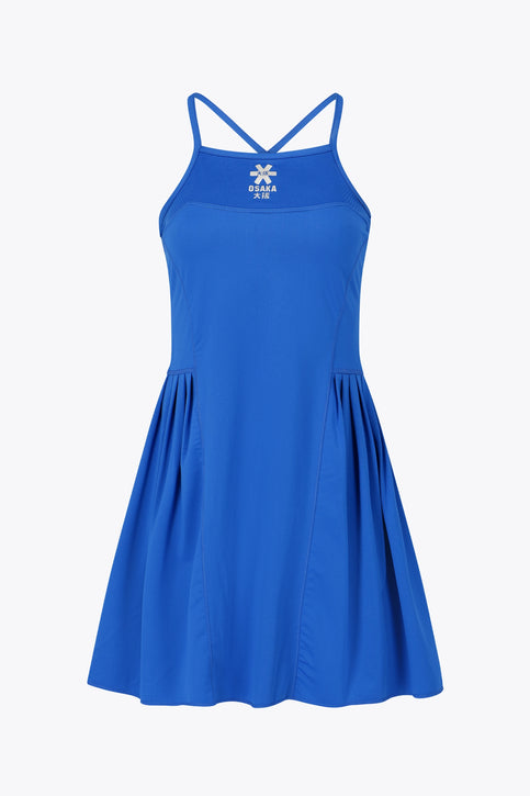 Osaka women pleated tech dress in princess blue with grey logo. Front flatlay view