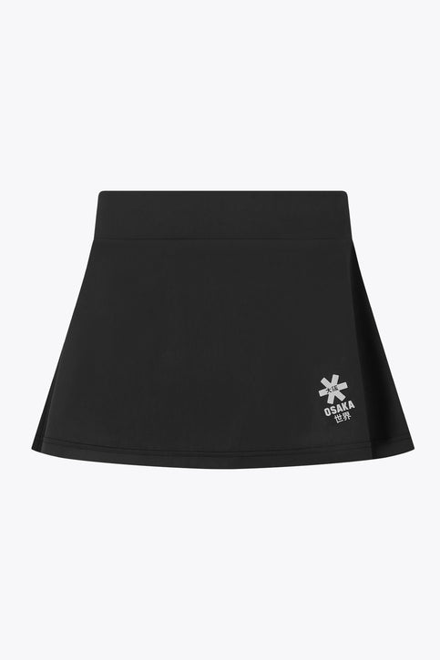 Osaka Women Floucy Skort | Black Osaka women floucy skort black with logo in grey. Front flatlay view