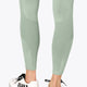 Osaka women shimuresu leggin in jadeite with logo in grey. Back detail bottom mesh view