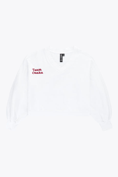 Osaka women v-neck cropped sweater white with logo in red. Front flatlay view
