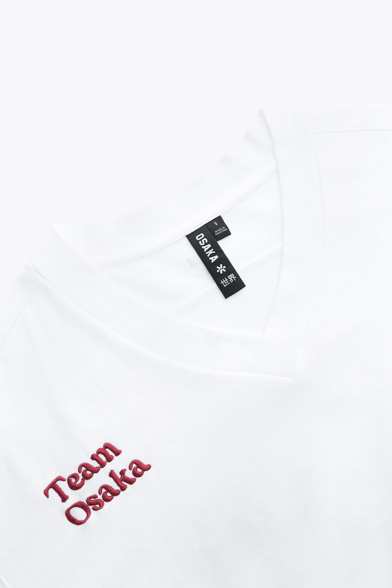 Osaka women v-neck cropped sweater white with logo in red. Front flatlay detail logoview