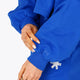 Osaka women cropped hoodie inprincess blue with college logo in white. Front detail sleeve view