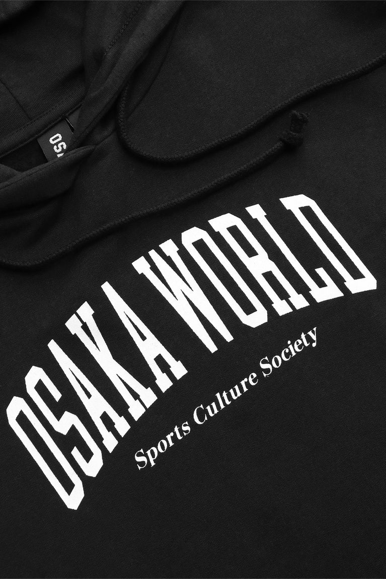 Osaka women cropped hoodie in black with college logo in white. Front flatlay detail logoview