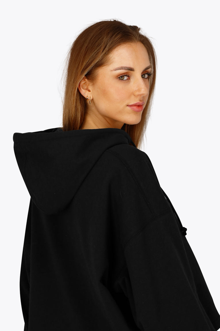 Osaka women cropped hoodie in black with college logo in white. Back detail cap view