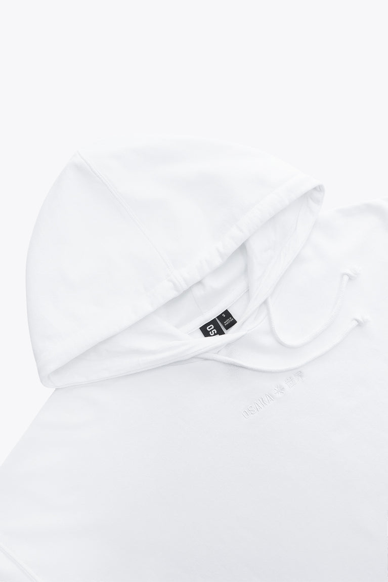 Osaka women cropped hoodie in white with logo in white. Front flatlay detail cap view