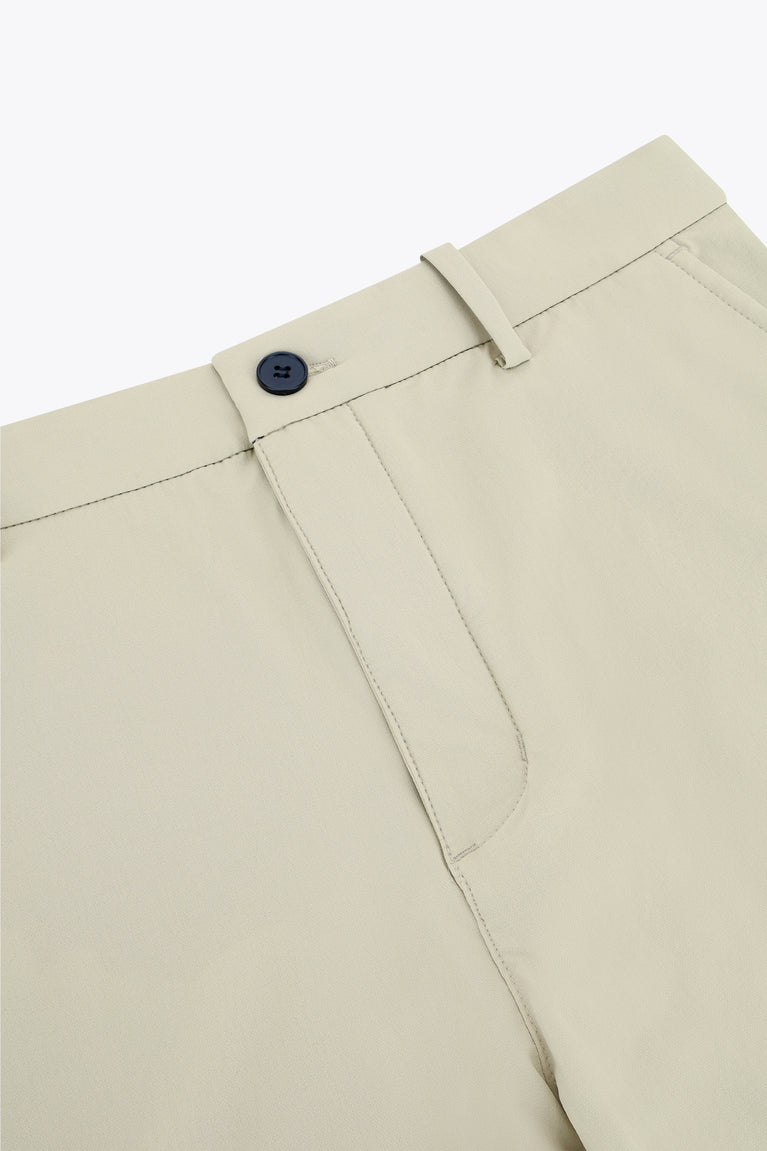 Beige men’s golf pants with button front, belt loops, and tailored fly