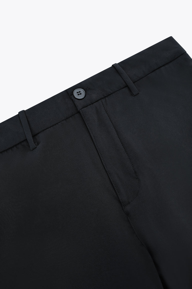 Black men’s technical golf pants with belt loops and covered button