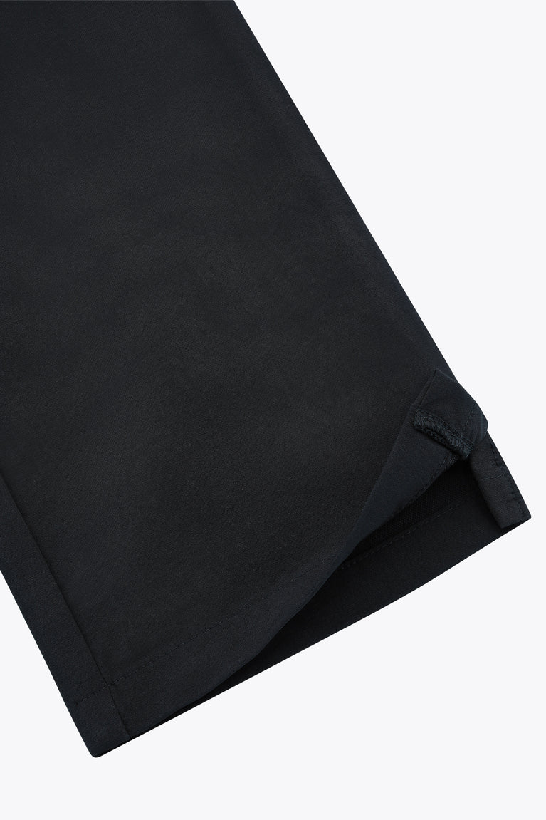 Black men’s technical golf pants with clean hem and stitched cuff detail