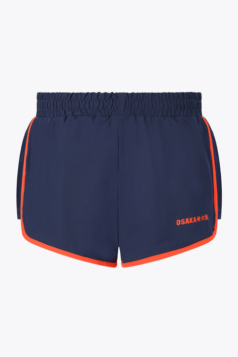 Osaka Women Court Short | Olympian Navy women’s court short with elastic waistband and orange side stripes