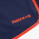 Women’s court shorts in navy with orange trim and Osaka logo