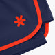 Navy court short with orange trim, red cross logo, and double-layer hem