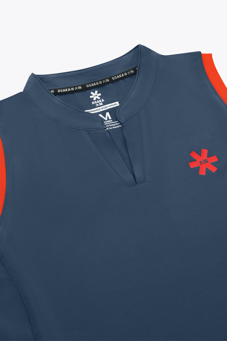 Women’s court tank top neckline, navy-blue V-neck with brand tag and red logo