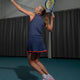 Women’s floucy skort by Olympian worn for tennis, dark navy with red trim.